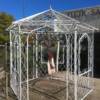 Beautiful 8 x 8 iron gazebo.  Three door openings and three windows.   There are six sides and six triangular tops.   Priced 695.    